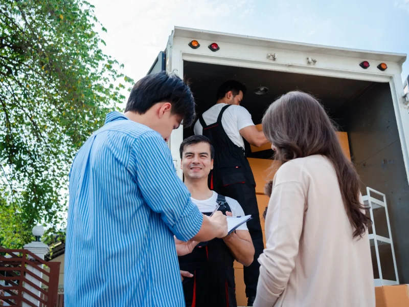 asian-couple-check-while-unloading-boxes-and-furni-2025-02-09-22-35-48-utc